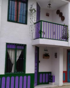 a building with colorful windows and a balcony at Loft urbano apartamento in Salento