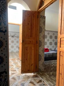 a door in a room with a bedroom at Dar Lala Haniya in Rabat