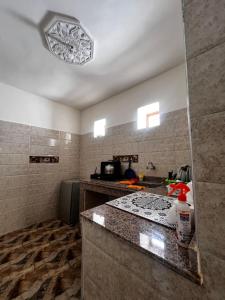 a kitchen with a sink and a counter top at Dar Lala Haniya in Rabat