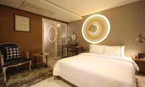 Voodi või voodid majutusasutuse Jeonju Mari Hotel toas