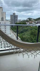 a balcony of a building with a view of a city at Excelente AP (novo) Praia Brava. in Itajaí