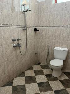 a bathroom with a toilet and a shower at Stardust Villa - ** Hotel in Paje