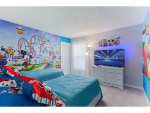 a bedroom with two beds and a roller coaster at Best place to unwind and have lots of fun! in Kissimmee