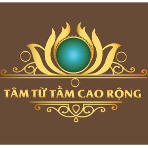 a gold logo with a blue ball in a crown at Thac Tien Village Ba Vi in Ba Vì