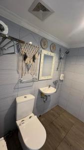 a bathroom with a toilet and a sink at La village hills view in Nusa Penida +31 photos