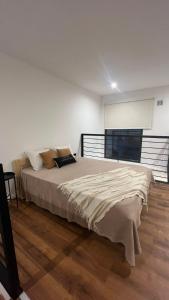 a bedroom with a large bed in a room at Duplex alquiler Mar del Plata in Mar del Plata