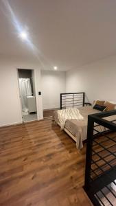 a bedroom with a bed and a wooden floor at Duplex alquiler Mar del Plata in Mar del Plata