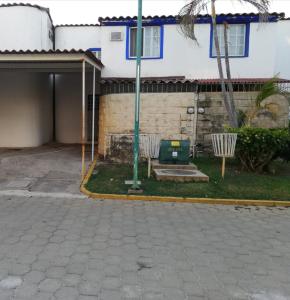 a building with a pavilion in front of a house at Escape Acapulco in Acapulco