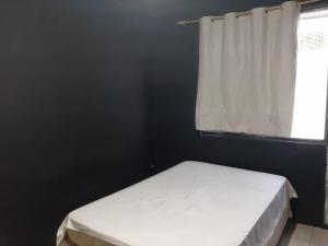 En eller flere senge i et værelse på Casa Winter - Seu Quarto Ideal