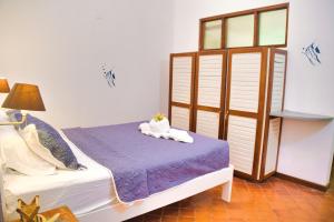 Postel nebo postele na pokoji v ubytování Samara Pacific Lodge