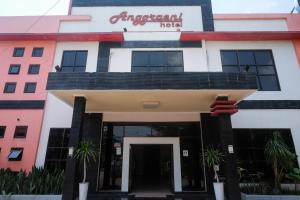 a building with a sign that reads embassy hotel at UrbanView Hotel Anggraeni Jatibarang 