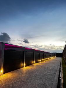 a long corridor with lights on the side of a building at All in Motel in Garanhuns