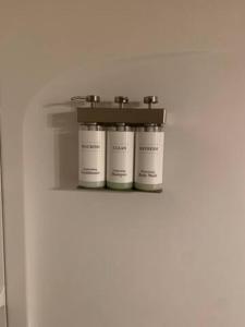 a shelf with four white containers on it at Morning Star Lodge - Hosted by Linda in Kellogg