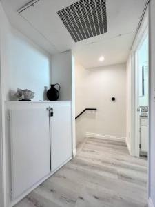 a hallway with white walls and a ceiling at Spacious 2BR near Hollywood - BR3 in Los Angeles