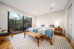a bedroom with a bed and a large window at Skyline Serenity Lux Hilltop Retreat Spa and Sauna in Los Angeles