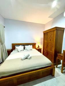 Postel nebo postele na pokoji v ubytování Chua Guest house Canggu
