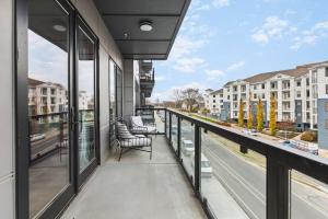 a balcony with a view of a street and buildings at Premium Condo with Huge Patio near Vanderbilt & Downtown in Nashville