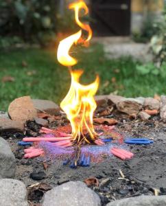 a grill with a fire in the middle at Unicorn Reborn - Peaceful Rentals in San Marcos La Laguna