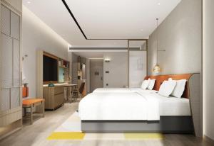 Home2 Suites By Hilton Hotel Guangzhou Baiyun International Airport Branch - Free Shuttle Bus to Guangzhou Baiyun International Airport & Free Deliver Service to Canton Fair Complex During Canton Fair Periodにあるベッド