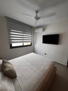 Lova arba lovos apgyvendinimo įstaigoje Cocotal Luxury apartment on the Golf Course