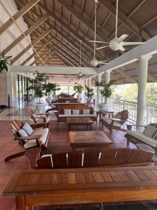 a lobby with couches and tables and chairs at Cocotal Luxury apartment on the Golf Course in Punta Cana