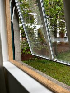 an open window with a view of a yard at City Centre 4 in Manchester