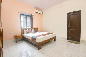 Voodi või voodid majutusasutuse FabExpress Joey's Place - Nr Panjim toas