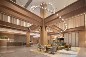 Home2 Suites By Hilton Hotel Guangzhou Baiyun International Airport Branch - Free Shuttle Bus to Guangzhou Baiyun International Airport & Free Deliver Service to Canton Fair Complex During Canton Fair Periodにあるシーティングエリア