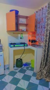 a toy desk in a room with a table at Nabbynates bnbs in Eldoret