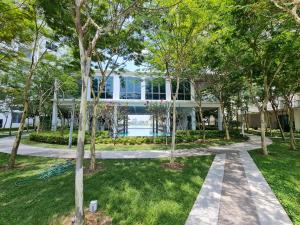 an exterior view of a house through trees at Great Escape by SM Retreats in Cyberjaya