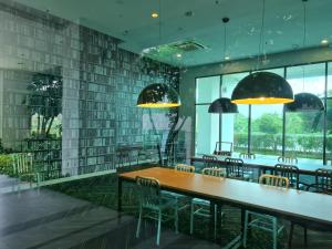 a dining room with a table and chairs at Great Escape by SM Retreats in Cyberjaya