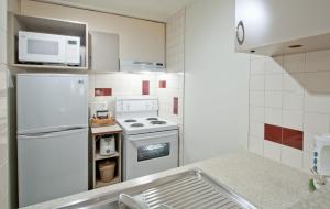 A cozinha ou cozinha compacta de L'Appartement Hôtel