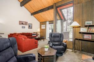 a living room with a red couch and chairs at Broomall at Snow Summit Ski Resort in Big Bear Lake