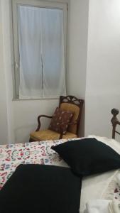 Postel nebo postele na pokoji v ubytování La Semplicità del Borgo
