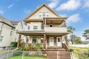 a house with a fence in front of it at Bedroom walking distance to Yale Bridgeport Hospital in Bridgeport