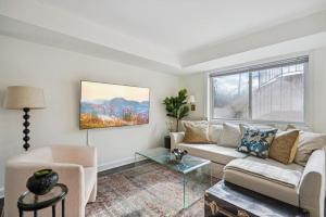 a living room with a couch and a glass table at Crystal City Charm Free Parking 102 in Arlington