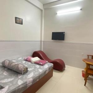 מיטה או מיטות בחדר ב-Nhà nghỉ Vân Anh