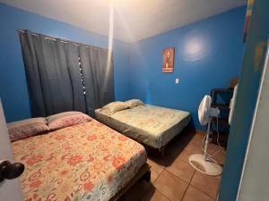 Postel nebo postele na pokoji v ubytování Las Casitas de Playa Ne gra