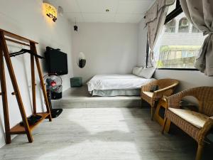 Katil atau katil-katil dalam bilik di Zhixinyuan B&B