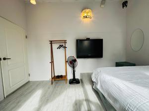 Katil atau katil-katil dalam bilik di Zhixinyuan B&B