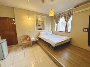 Katil atau katil-katil dalam bilik di Zhixinyuan B&B