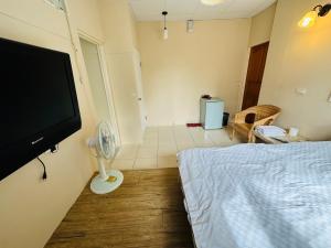 Televisyen dan/atau pusat hiburan di Zhixinyuan B&B
