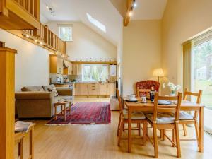 a kitchen and living room with a table and chairs at 1 Bed in Nantyglo 58304 in Nantyglo