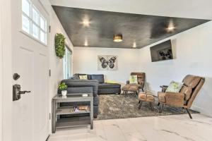 a living room with a couch and chairs at Sleek Great Falls Retreat in Great Falls