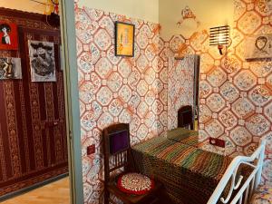 a room with a table with a laptop on it at Lets Go House in Tbilisi City