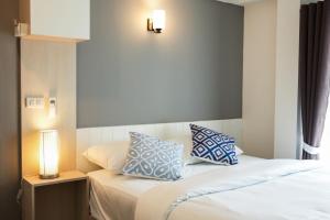 Postel nebo postele na pokoji v ubytování Prix Hotel