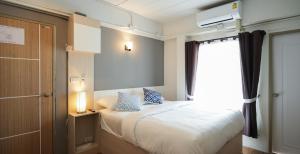 Postel nebo postele na pokoji v ubytování Prix Hotel