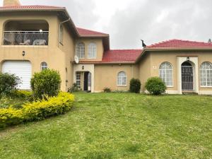 a large house with a yard in front of it at Sombedu guest suite in Margate