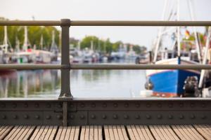 a view of a dock with boats in the water at Haus Juliane, Kuestenlinie in Warnemünde +6 photos
