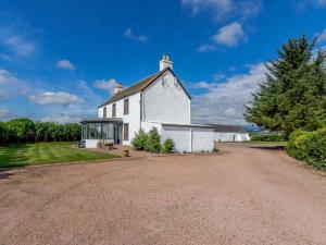 an old white church with a gravel driveway at 3 Bed in Crieff 78313 in Madderty